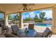 Covered patio with ample seating overlooking the pool and desert backyard, perfect for entertaining at 15803 E Tumbleweed Dr, Fountain Hills, AZ 85268