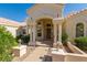 Close-up of the front entrance showcasing the arched entryway, detailed columns, and a well-maintained walkway at 15803 E Tumbleweed Dr, Fountain Hills, AZ 85268