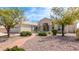 Inviting single-story home featuring manicured landscaping, a tile roof, and an arched entryway with stately columns at 15803 E Tumbleweed Dr, Fountain Hills, AZ 85268