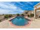 Refreshing swimming pool with a spa, surrounded by lush landscaping and a beautiful backyard at 15803 E Tumbleweed Dr, Fountain Hills, AZ 85268