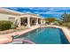 Inviting backyard swimming pool and spa with lush landscaping in a serene outdoor setting at 15803 E Tumbleweed Dr, Fountain Hills, AZ 85268