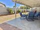 Spacious backyard featuring a covered patio, tile floor, gravel, block wall, and seating area at 16243 N 27Th St, Phoenix, AZ 85032