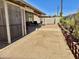 Spacious backyard featuring a covered patio, gravel, block wall, and seating area at 16243 N 27Th St, Phoenix, AZ 85032