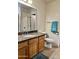 Bathroom with granite countertop, wood cabinets and mirrors at 16243 N 27Th St, Phoenix, AZ 85032