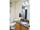 Bathroom featuring a granite countertop, wood cabinet and tile flooring at 16243 N 27Th St, Phoenix, AZ 85032