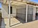 Comfortable covered patio featuring tile floors, a gated patio and a ceiling fan at 16243 N 27Th St, Phoenix, AZ 85032