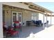 Inviting covered patio with string lights, a ceiling fan, and comfortable seating area at 16243 N 27Th St, Phoenix, AZ 85032