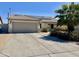 Charming single-story home with a two-car garage, solar panels, and desert landscaping at 16243 N 27Th St, Phoenix, AZ 85032