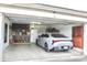 Organized two-car garage, featuring cabinetry, a refrigerator, and a modern Kia sedan at 16243 N 27Th St, Phoenix, AZ 85032