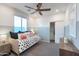 This bedroom features a comfortable single bed, neutral walls, and a closet at 17162 W Corrine Dr, Surprise, AZ 85388