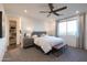 This spacious bedroom features modern décor, recessed lighting, and a ceiling fan at 17162 W Corrine Dr, Surprise, AZ 85388