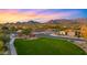 Aerial view of the community featuring a playground, park, mountain views, and surrounding homes at 17505 N 96Th Way, Scottsdale, AZ 85255