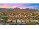 Wide aerial view of the community, showcasing mountain views and neighborhood layout at 17505 N 96Th Way, Scottsdale, AZ 85255