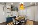 Beautiful dining area featuring built-in storage, modern lighting, and large windows for ample natural light at 17505 N 96Th Way, Scottsdale, AZ 85255