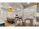 Open concept dining room and living room with modern lighting, and stylish decor creating an inviting atmosphere at 17505 N 96Th Way, Scottsdale, AZ 85255