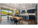 Bright kitchen and dining area with modern appliances, a center island, and sliding glass doors to the outdoor space at 17505 N 96Th Way, Scottsdale, AZ 85255