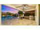 Entertainer's backyard features a built-in barbecue, outdoor television, and beautiful patio at 17505 N 96Th Way, Scottsdale, AZ 85255