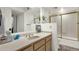 Bathroom featuring a shower over tub with gold trim, vanity, toilet, and light tile flooring at 18833 E Latigo Ln, Rio Verde, AZ 85263