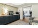 Bonus room features floral wallpaper, wet bar, sitting area, and view into adjoining bedroom at 18833 E Latigo Ln, Rio Verde, AZ 85263