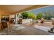 Spacious covered patio with tiled and paved areas, offering a comfortable outdoor living space at 18833 E Latigo Ln, Rio Verde, AZ 85263