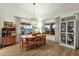 Bright dining room boasts natural light, stylish decor, and an elegant chandelier at 18833 E Latigo Ln, Rio Verde, AZ 85263