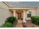 Close-up of the front entrance showcasing detailed columns and a decorative front door at 18833 E Latigo Ln, Rio Verde, AZ 85263