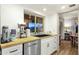 Bright kitchen features white cabinets, stainless steel appliances and butcher block countertops, with breakfast nook view at 18833 E Latigo Ln, Rio Verde, AZ 85263