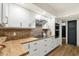 Bright kitchen features white cabinets, stainless steel appliances, brick backsplash and butcher block countertops at 18833 E Latigo Ln, Rio Verde, AZ 85263