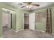 Carpeted bedroom featuring closet, bathroom, and an entry door at 20421 N 3Rd Dr # 2, Phoenix, AZ 85027