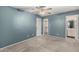 Spacious bedroom featuring soft gray carpet, closet and adjoined bathroom at 20421 N 3Rd Dr # 2, Phoenix, AZ 85027