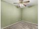 Bedroom with gray carpeting, olive paint, and a ceiling fan at 20421 N 3Rd Dr # 2, Phoenix, AZ 85027