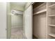 Walk-in closet with shelves on the right, and an opening to the bedroom at 20421 N 3Rd Dr # 2, Phoenix, AZ 85027