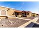 View of the exterior showcasing a well-manicured yard with a sidewalk leading to the front door at 20421 N 3Rd Dr # 2, Phoenix, AZ 85027