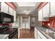 View of the kitchen featuring white cabinets and stainless steel appliances at 20421 N 3Rd Dr # 2, Phoenix, AZ 85027