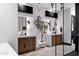 Modern bathroom featuring dual sinks, custom cabinetry and decorative lighting at 20745 N Verbena Ln, Maricopa, AZ 85138