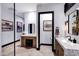 Beautiful bathroom featuring dual sinks, vanity area, decorative accents, and modern design at 20745 N Verbena Ln, Maricopa, AZ 85138