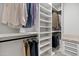 Organized walk-in closet with custom shelving, hanging rods, and ample storage space at 20745 N Verbena Ln, Maricopa, AZ 85138