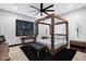 Bedroom with a four-poster bed, modern design and stylish accents at 20745 N Verbena Ln, Maricopa, AZ 85138