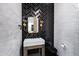 Modern powder room featuring herringbone tile accent wall and contemporary fixtures at 20745 N Verbena Ln, Maricopa, AZ 85138