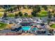 Aerial view of community clubhouse with pool, parking and golf course at 2284 Leisure World --, Mesa, AZ 85206