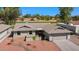 A high angle view of a single story home with a two car garage and view of the golf course at 2284 Leisure World --, Mesa, AZ 85206