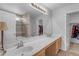 Bathroom with double sinks, large mirror, and tiled shower at 2501 E Los Alamos St, Gilbert, AZ 85295