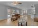 Bright living room with hardwood floors and large windows overlooking the backyard at 2501 E Los Alamos St, Gilbert, AZ 85295