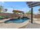 Resort-style pool area with a rock slide and comfortable seating, perfect for outdoor fun and relaxation at 2501 E Los Alamos St, Gilbert, AZ 85295