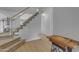 Carpeted staircase leading to the upper level, with white railings and a view of the landing, plus natural light at 2501 E Los Alamos St, Gilbert, AZ 85295