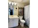 Bathroom featuring a vanity and shelf with a patterned shower curtain at 2542 S Rowen St, Mesa, AZ 85209