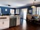 Updated kitchen view showcasing stainless steel appliances, eating area and bright lighting at 2542 S Rowen St, Mesa, AZ 85209