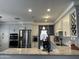 Open kitchen view featuring stainless appliances, granite counters and natural lighting at 2542 S Rowen St, Mesa, AZ 85209