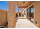 A covered patio is perfect for outdoor living with desert landscaping and sliding glass door at 2565 S Signal Butte Rd # 8, Mesa, AZ 85209