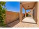 A covered patio is the perfect place to relax and enjoy the desert landscaping and sunny skies at 2565 S Signal Butte Rd # 8, Mesa, AZ 85209